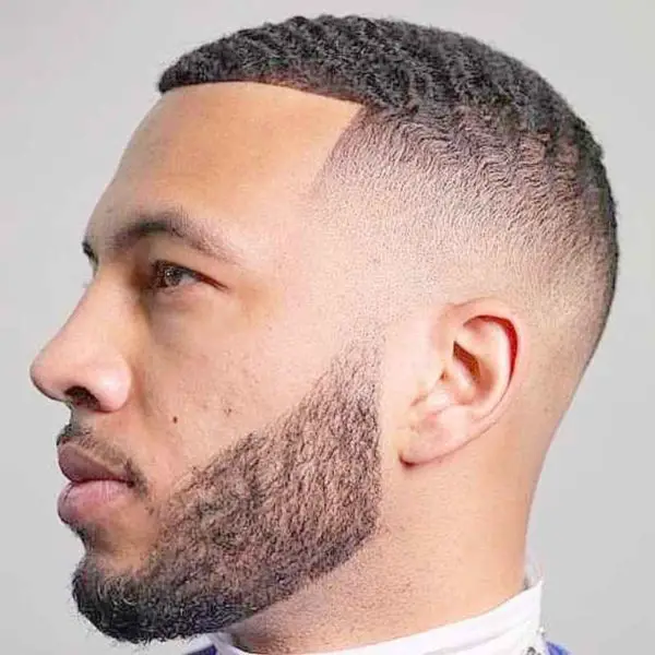 Short faded beard style with waves