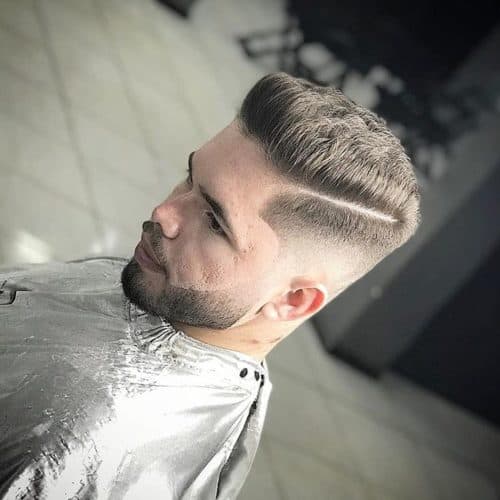 Trendy beard fade Cool and trendy beard fade with parted hairstyle.