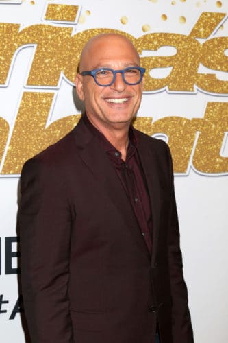 AGT Judge Howie Mandel bald head AGT Judge Howie Mandel with a shaved bald head.