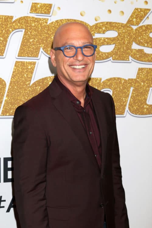 AGT Judge Howie Mandel with a shaved bald head.