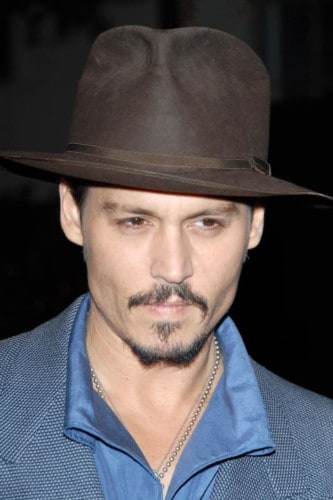 A shorter beard like Johnny Depp's can help deal with an uneven beard