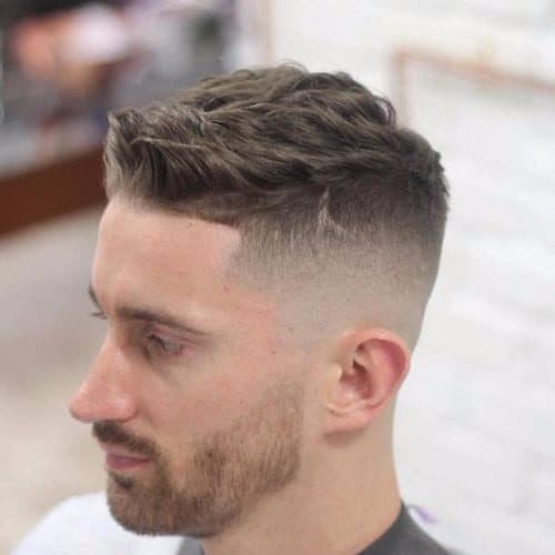 Spiky Front Comb Over Hairstyle with a Mid Bald Fade